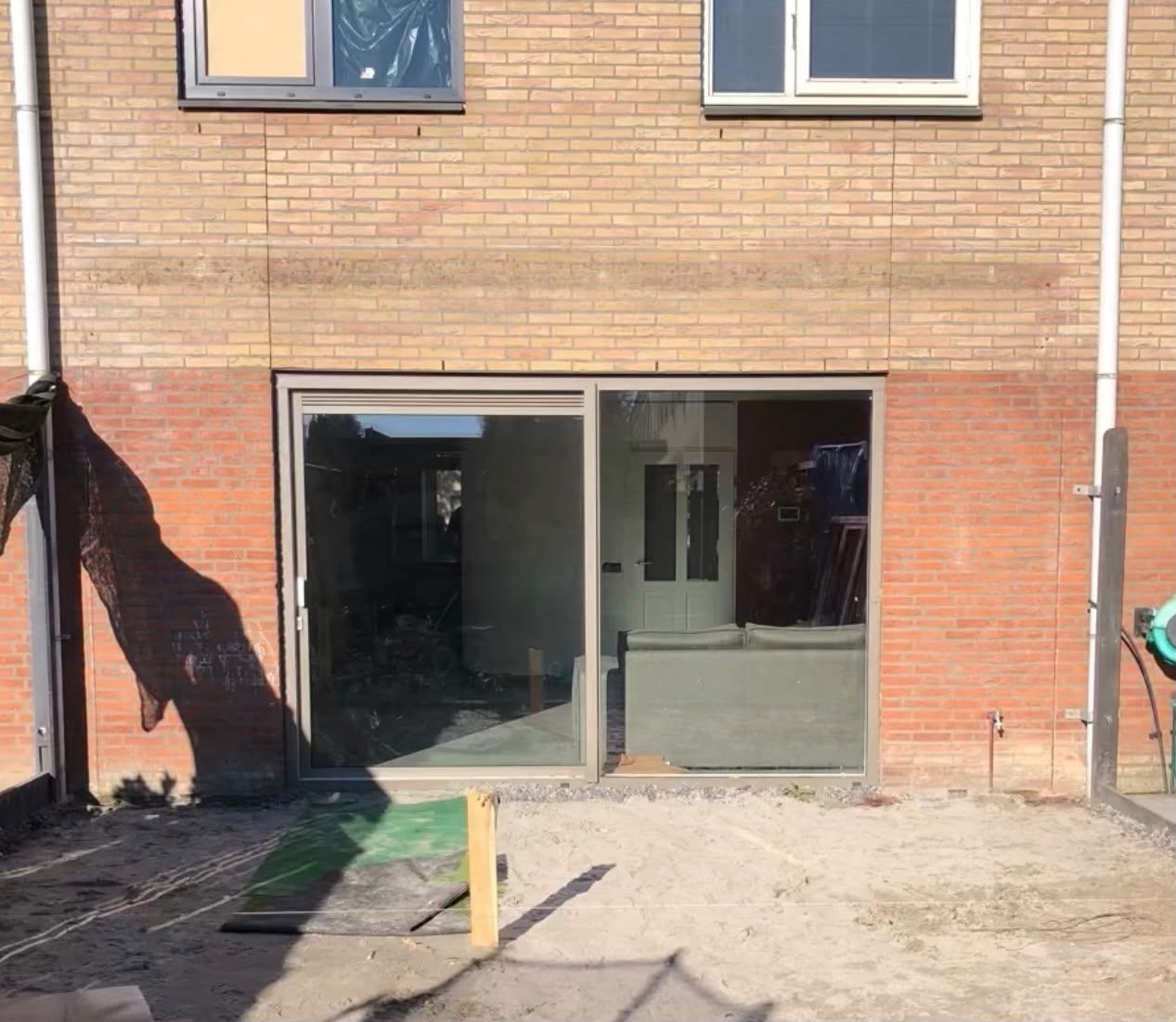 Achtergevel voor de uitbouw